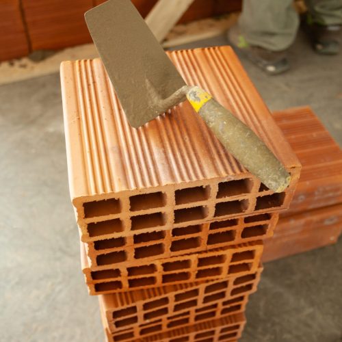 Masonry wall bricks. Building construction concept.